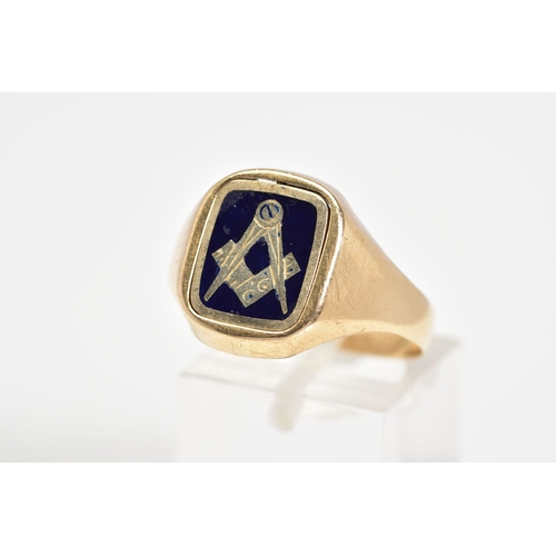 29 - A 9CT GOLD MASONIC RING, designed with a square swivel panel with Masonic emblem finished with blue ... 