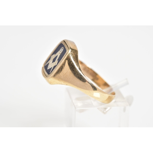 29 - A 9CT GOLD MASONIC RING, designed with a square swivel panel with Masonic emblem finished with blue ... 