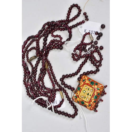 37 - FOUR JEWELLERY ITEMS, to include a Rajasthani enamelled pendant strung to a garnet bead necklace, a ... 