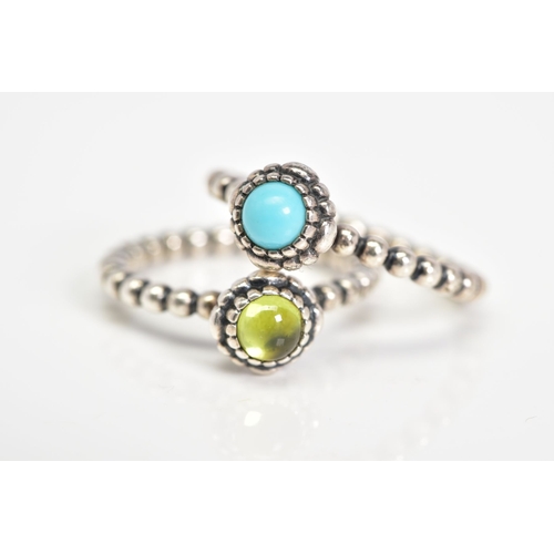 42 - TWO PANDORA BIRTHSTONE RINGS, the first set with a central peridot cabochon, to the beaded shank, ri... 