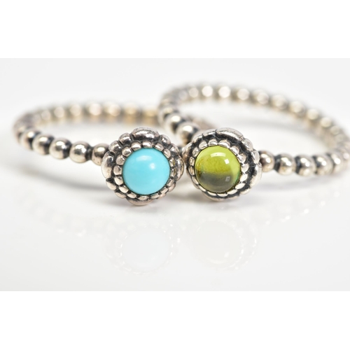 42 - TWO PANDORA BIRTHSTONE RINGS, the first set with a central peridot cabochon, to the beaded shank, ri... 