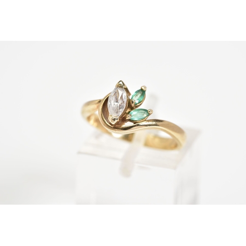 49 - A 9CT GOLD THREE STONE RING, designed with a marquise cut cubic zirconia with two marquise cut emera... 