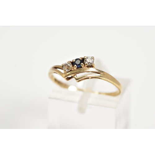 52 - A 9CT GOLD RING, designed with a double V shape shank with a row of two round brilliant cut cubic zi... 