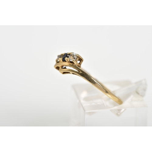 52 - A 9CT GOLD RING, designed with a double V shape shank with a row of two round brilliant cut cubic zi... 