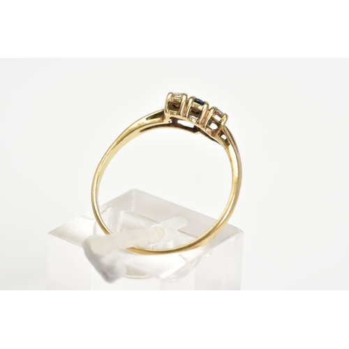 52 - A 9CT GOLD RING, designed with a double V shape shank with a row of two round brilliant cut cubic zi... 