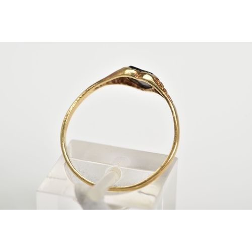 61 - A 9CT GOLD RING, designed with a central onyx heart and scrolling detail shoulders, with a 9ct hallm... 