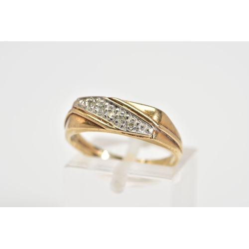 67 - A 9CT GOLD DIAMOND RING, designed as a rectangle panel set with a diagonal row of single cut diamond... 