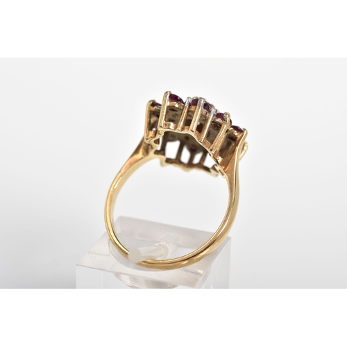 89 - A 9CT GOLD CLUSTER RING, designed with a central oval cut garnet and single cut diamond and circular... 