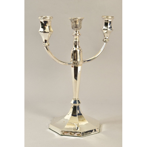 105 - A GEORGE VI SILVER CANDELABRUM, three branch with two shaped octagonal candleholders and an engraved... 