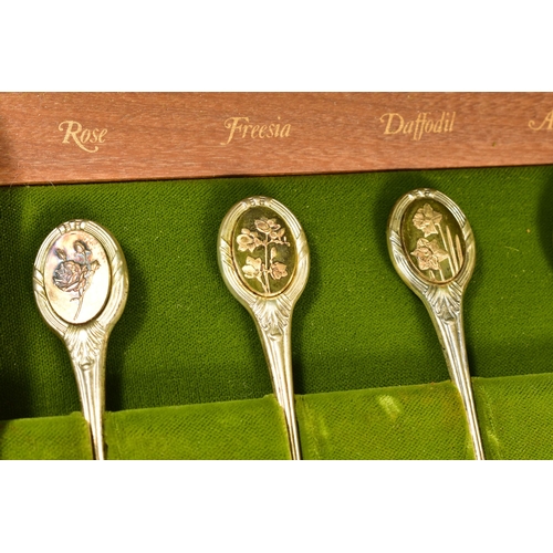 118 - A CASED SET OF TWELVE 'THE ROYAL HORTICULTURAL SOCIETY FLOWER SPOONS', sponsor John Pinches, Sheffie... 