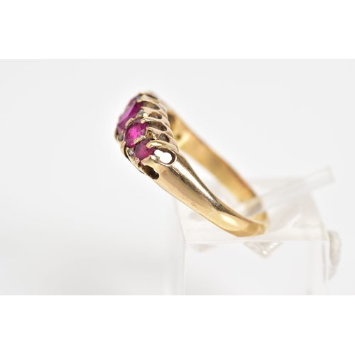 158 - AN 18CT GOLD FIVE STONE RING, of boat design set with oval and circular cut rubies, interspaced with... 