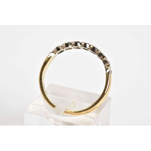 173 - A DIAMOND HALF ETERNITY RING, set with a row of round brilliant cut diamonds, each within a crossove... 