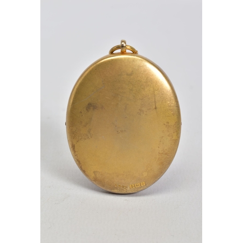 175 - A SILVER GILT MEDALLION, of oval shape featuring a blue enamel centre with bird embellishment and Wo... 