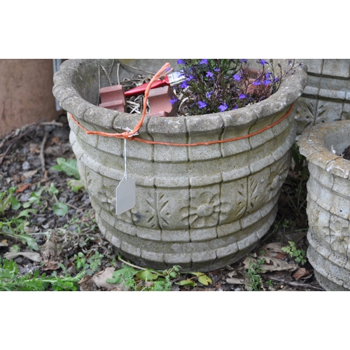 1020 - THREE LARGE ROUND COMPOSITE GARDEN PLANTERS, 39cm diameter and 30cm high, a pair of smaller 29cm dia... 