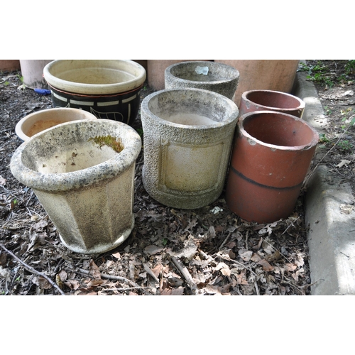 1021 - SEVEN GARDEN PLANTERS, including a pair of terracotta pipes, 26cm diameter x 32cm high, a pair of co... 