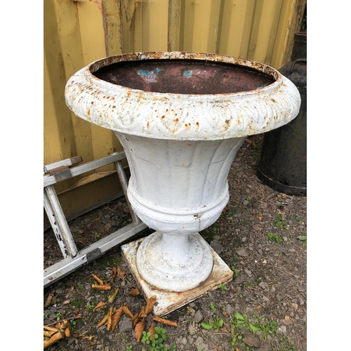 1024 - A PAINTED CAST IRON GARDEN URN, on a square base, diameter 54cm x 69cm