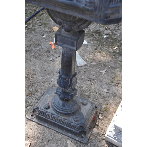 1005 - A MODERN CAST IRON POST BOX, with Chinese pagoda style roof, horse and rider detail to casting on th... 