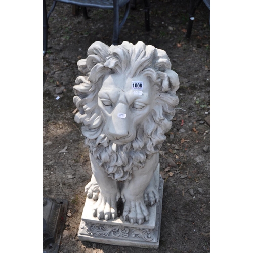 1006 - A MODERN RESIN FIGURE OF A MALE LION, on a foliate detailed plinth (all one piece) 80cm high