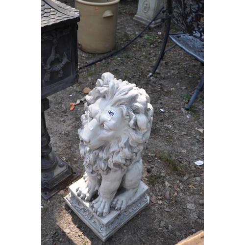 1006 - A MODERN RESIN FIGURE OF A MALE LION, on a foliate detailed plinth (all one piece) 80cm high