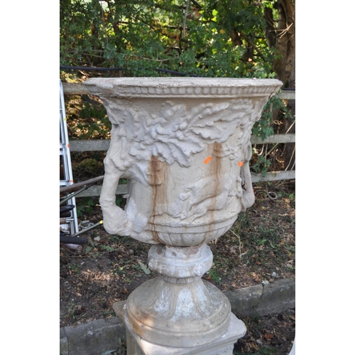 1009 - A LARGE COMPOSITE THREE PIECE GARDEN URN ON STAND, with foliate and hunting scene detail to body of ... 