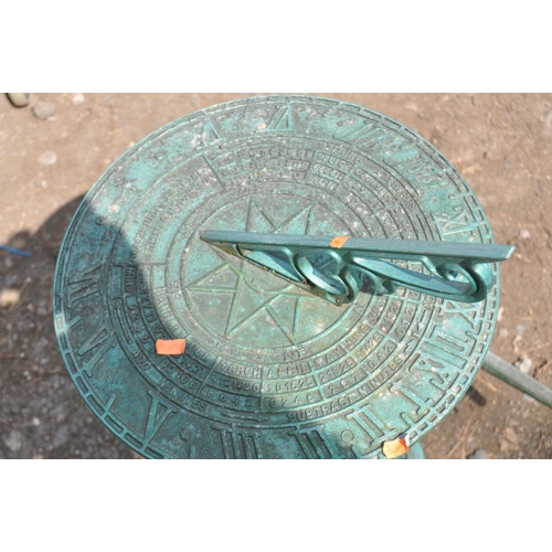 1014 - A MODERN CAST METAL SUN DIAL, with time, day and month markings to dial, on a tapered stem with fret... 