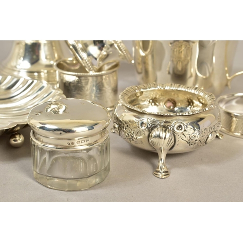 106 - A GROUP OF SILVER, comprising an Elizabeth II candle holder, lacking a glass shade, loaded base, Bir... 