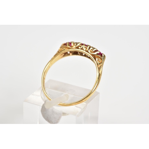 11 - AN EARLY 20TH CENTURY 18CT GOLD RUBY AND DIAMOND RING, designed with three circular cut rubies inter... 