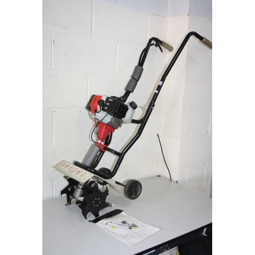 1113 - AN ECKMAN 2 STROKE PETROL GARDEN TILLER, with manual (we have seen it working along with a dated mag... 