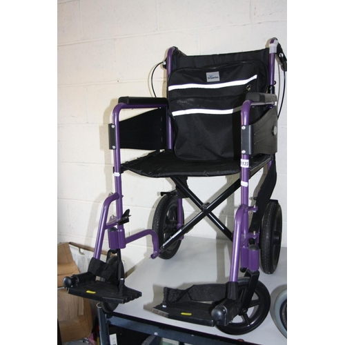 1123 - TWO WHEELCHAIRS, both with footrests, one is a Days with a metallic purple finish and a standard 40c... 