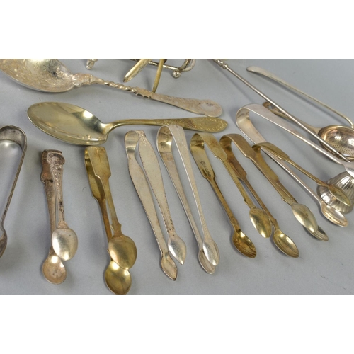 113 - A SELECTION OF WHITE METAL CULTERY, to include a pair of George lll silver engraved sugar tongs, a p... 