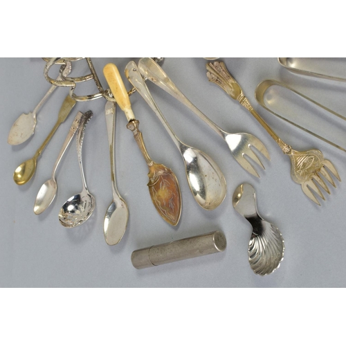 113 - A SELECTION OF WHITE METAL CULTERY, to include a pair of George lll silver engraved sugar tongs, a p... 