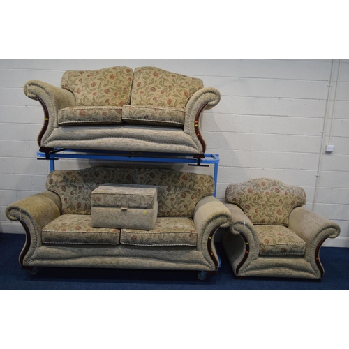 1203 - A CREAM AND FLORAL UPHOLSTERED FOUR PIECE LOUNGE SUITE, comprising a three and a two seater settee, ... 