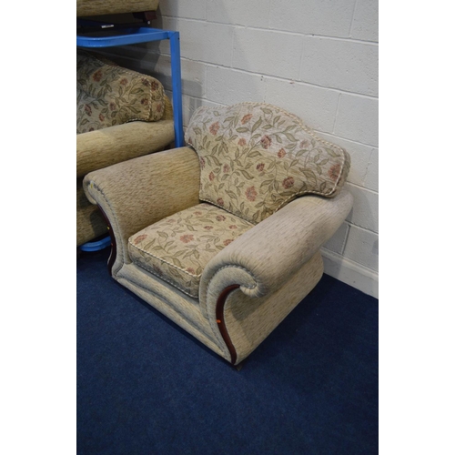 1203 - A CREAM AND FLORAL UPHOLSTERED FOUR PIECE LOUNGE SUITE, comprising a three and a two seater settee, ... 