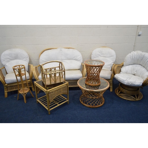 1204 - A WICKER CONSERVATORY SEAT comprising a two seater settee, a pair of armchairs, together with a simi... 