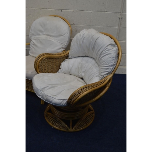 1204 - A WICKER CONSERVATORY SEAT comprising a two seater settee, a pair of armchairs, together with a simi... 