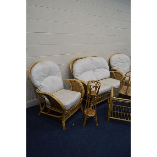 1204 - A WICKER CONSERVATORY SEAT comprising a two seater settee, a pair of armchairs, together with a simi... 