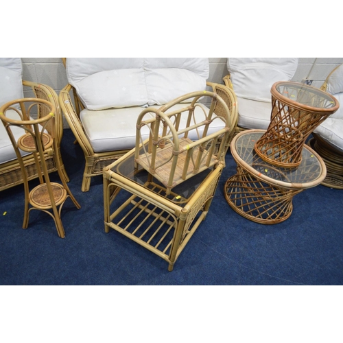 1204 - A WICKER CONSERVATORY SEAT comprising a two seater settee, a pair of armchairs, together with a simi... 