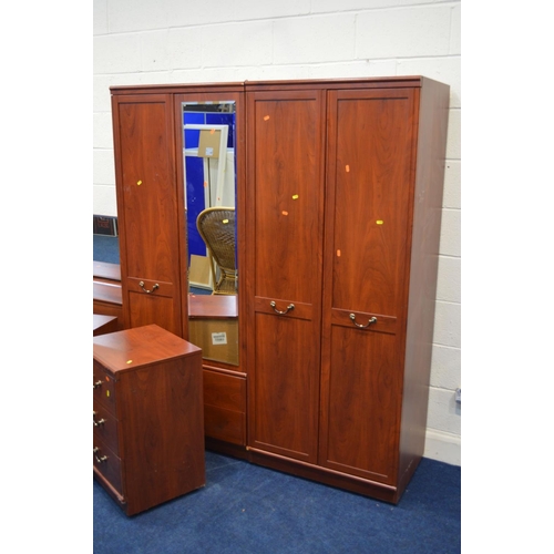 1208 - A MODERN MAHOGANY FINISH FOUR PIECE BEDROOM SUITE, comprising two double door wardrobes, dressing ta... 