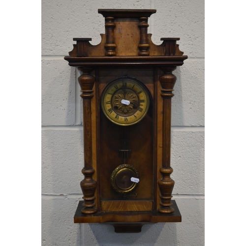 1210 - A LATE 19TH CENTURY WALNUT VIENNA WALL CLOCK (missing finials) (winding key, pendulum)