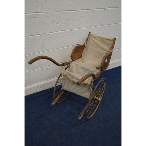 1213 - AN EARLY 20TH CENTURY BEECH CHILDS BENTWOOD RICKSHAW, having a fabric seat and footrest, on twin car... 