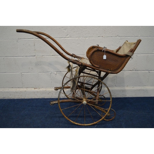 1213 - AN EARLY 20TH CENTURY BEECH CHILDS BENTWOOD RICKSHAW, having a fabric seat and footrest, on twin car... 