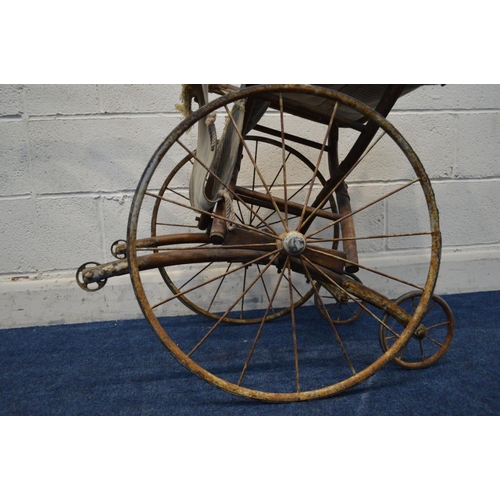 1213 - AN EARLY 20TH CENTURY BEECH CHILDS BENTWOOD RICKSHAW, having a fabric seat and footrest, on twin car... 