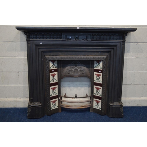 1215 - A VICTORIAN STYLE CAST IRON FIRE SURROUND and insert with Art Nouveau burgundy, green and white grou... 