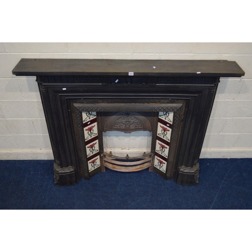 1215 - A VICTORIAN STYLE CAST IRON FIRE SURROUND and insert with Art Nouveau burgundy, green and white grou... 