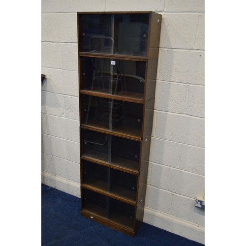 1217 - AN EARLY TO MID 20TH CENTURY UNIX OAK MODULAR SIX SECTION SHELVING UNIT with double sliding glass fr... 