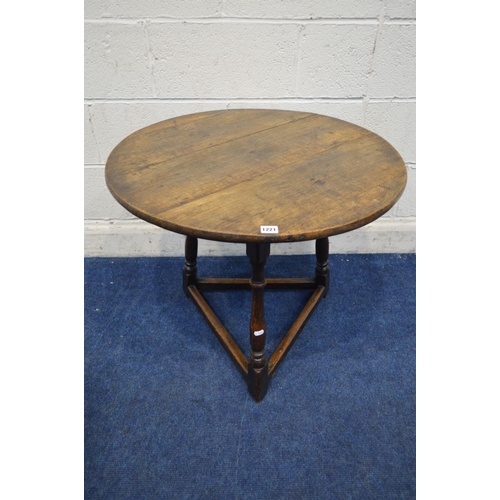 1221 - AN 18TH CENTURY CIRCULAR OAK PLANK TOP CRICKET TABLE, with joint splayed turned legs, united by stre... 