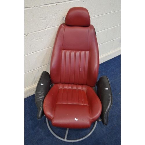 1235 - A RED AND BLACK LEATHER SWIVEL CHAIR, previously a car seat