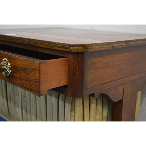 1249 - A REGENCY ROSEWOOD WORK TABLE, rectangular top with rounded corners, and brass banding to edge, with... 