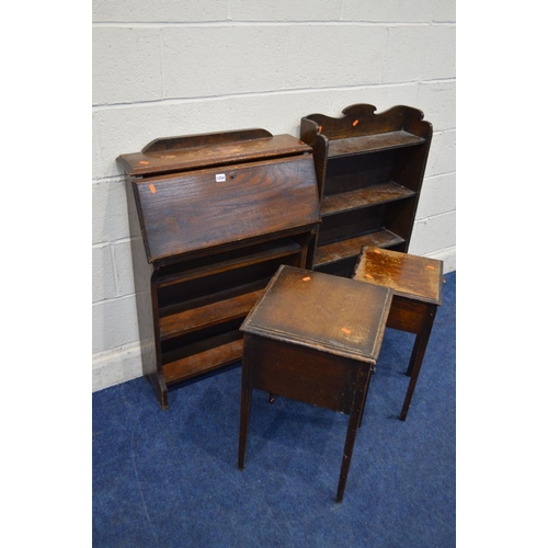 1254 - A SLIM OAK BUREAU, together with an open bookcase, two oak sewing boxes (s.d.) (4)