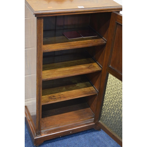 1260 - AN EDWARDIAN WALNUT SINGLE DOOR CABINET, with foliate panelled doors above a glass panel, width 54cm... 